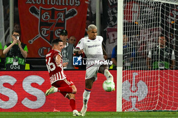 2024-05-29 - Dodo (A.C.F. Fiorentina) in action against Daniel Podence (Olympiacos F.C.) during UEFA Europa Conference League 2024 final soccer match between Olympiacos F.C. vs. A.C.F. Fiorentina at OPAP Arena, Athens, 29th of May 2024 - FINAL - OLYMPIACOS VS ACF FIORENTINA - UEFA CONFERENCE LEAGUE - SOCCER