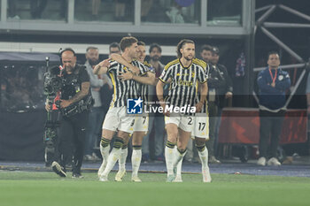 2024-05-15 - Juventus' Serbian forward Dusan Vlahovic celebrates after scoring a goal during the Italian Cup final football match between Atalanta and Juventus at Stadio Olimpico on May 15,2024 in Rome, Italy. - FINAL - JUVENTUS FC VS ATALANTA BC - ITALIAN CUP - SOCCER