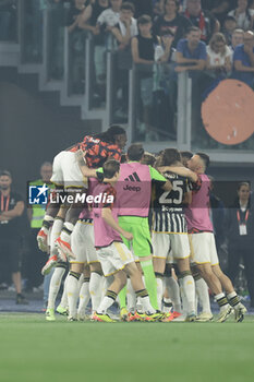 2024-05-15 - Juventus' Serbian forward Dusan Vlahovic celebrates after scoring a goal during the Italian Cup final football match between Atalanta and Juventus at Stadio Olimpico on May 15,2024 in Rome, Italy. - FINAL - JUVENTUS FC VS ATALANTA BC - ITALIAN CUP - SOCCER