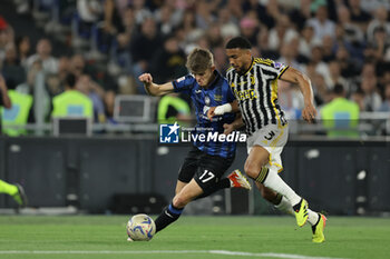 2024-05-15 - Atalanta's Belgian forward Charles De Ketelaere challenges for the ball with Juventus' Brazilian defender Bremer during the Italian Cup final football match between Atalanta and Juventus at Stadio Olimpico on May 15,2024 in Rome, Italy. - FINAL - JUVENTUS FC VS ATALANTA BC - ITALIAN CUP - SOCCER