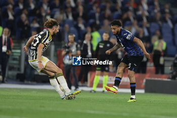 2024-05-15 - Atalanta's Brazilian midfielder Ederson challenges for the ball with Juventus' French midfielder Adrien Rabiot during the Italian Cup final football match between Atalanta and Juventus at Stadio Olimpico on May 15,2024 in Rome, Italy. - FINAL - JUVENTUS FC VS ATALANTA BC - ITALIAN CUP - SOCCER