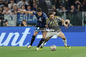 2024-05-15 - Atalanta's Dutch defender Hans Hateboer challenges for the ball with Juventus' Italian midfielder Fabio Miretti during the Italian Cup final football match between Atalanta and Juventus at Stadio Olimpico on May 15,2024 in Rome, Italy. - FINAL - JUVENTUS FC VS ATALANTA BC - ITALIAN CUP - SOCCER