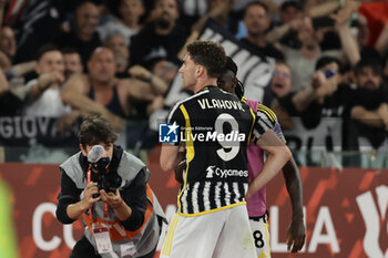 2024-05-15 - Juventus' Serbian forward Dusan Vlahovic celebrates after scoring a goal during the Italian Cup final football match between Atalanta and Juventus at Stadio Olimpico on May 15,2024 in Rome, Italy. - FINAL - JUVENTUS FC VS ATALANTA BC - ITALIAN CUP - SOCCER