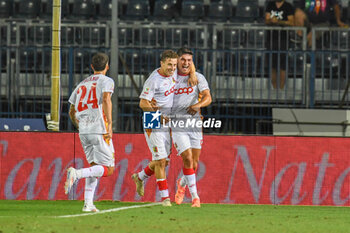 2024-08-10 - Catanzaro's Federico Bonini celebrates with teammates after scoring the 1-1 goal - EMPOLI FC VS US CATANZARO - ITALIAN CUP - SOCCER