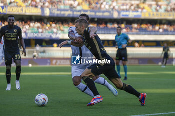 2024-08-10 - Darko Lazovic of Hellas Verona FC competes for the ball with Joseph Ceesay of Cesena FC during Hellas Verona FC vs Cesena FC, round of 32° Coppa Italia Frecciarossa 2024-25, at MarcAntonio Bentegodi stadium in Verona (VR), Italy, on August 10, 2024. - HELLAS VERONA FC VS CESENA FC - ITALIAN CUP - SOCCER