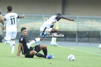 2024-08-10 - Diego Coppola of Hellas Verona FC battle for the ball with Joseph Ceesay of Cesena FC during Hellas Verona FC vs Cesena FC, round of 32° Coppa Italia Frecciarossa 2024-25, at MarcAntonio Bentegodi stadium in Verona (VR), Italy, on August 10, 2024. - HELLAS VERONA FC VS CESENA FC - ITALIAN CUP - SOCCER