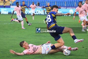 2024-08-11 - Kristoffer Lund (Palermo FC) fights for the ball with Dennis Man (Parma Calcio) - PARMA CALCIO VS PALERMO FC - ITALIAN CUP - SOCCER