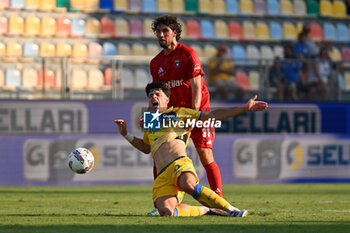 2024-08-12 - Giuseppe Ambrosino of Frosinone Calcio and Arturo Calabresi of Pisa Sporting Club during the Frecciarossa Italian Cup round of 32 match between Frosinone Calcio vs Pisa Sporting Club at Benito Stirpe Stadium on August 12, 2024 in Frosinone, Italy. - FROSINONE CALCIO VS PISA SC - ITALIAN CUP - SOCCER