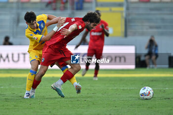 2024-08-12 - Giuseppe Ambrosino of Frosinone Calcio and Arturo Calabresi of Pisa Sporting Club during the Frecciarossa Italian Cup round of 32 match between Frosinone Calcio vs Pisa Sporting Club at Benito Stirpe Stadium on August 12, 2024 in Frosinone, Italy. - FROSINONE CALCIO VS PISA SC - ITALIAN CUP - SOCCER