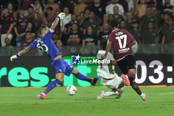 2024-08-12 - Luigi Sepe of US Salernitana 1919 competes for the ball with Nicolo Bertola of Spezia Calcio during the Soccer Italian Cup Freccia Rossa between US Salernitana 1919 vs Spezia Calcio at Arechi Stadium - US SALERNITANA VS SPEZIA CALCIO - ITALIAN CUP - SOCCER