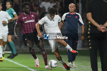 2024-08-12 - Pietro Candelari of Spezia Calcio competes for the ball with Boulaye Dia of US Salernitana 1919 during the Soccer Italian Cup Freccia Rossa between US Salernitana 1919 vs Spezia Calcio at Arechi Stadium - US SALERNITANA VS SPEZIA CALCIO - ITALIAN CUP - SOCCER