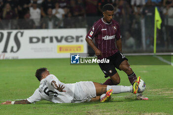 2024-08-12 - Lilian Njoh of US Salernitana 1919 competes for the ball with Salvatore Esposito of Spezia Calcio during the Soccer Italian Cup Freccia Rossa between US Salernitana 1919 vs Spezia Calcio at Arechi Stadium - US SALERNITANA VS SPEZIA CALCIO - ITALIAN CUP - SOCCER