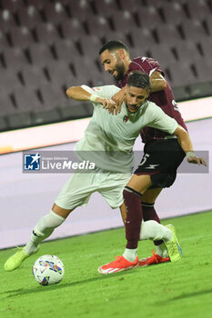 2024-08-12 - Flavius Daniliuc of US Salernitana 1919 competes for the ball with Nicolo Bertola of Spezia Calcio during the Soccer Italian Cup Freccia Rossa between US Salernitana 1919 vs Spezia Calcio at Arechi Stadium - US SALERNITANA VS SPEZIA CALCIO - ITALIAN CUP - SOCCER