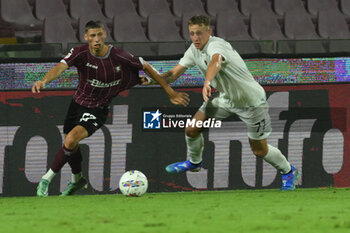 2024-08-12 - Lilian Njoh of US Salernitana 1919 competes for the ball with Nicolo Bertola of Spezia Calcio during the Soccer Italian Cup Freccia Rossa between US Salernitana 1919 vs Spezia Calcio at Arechi Stadium - US SALERNITANA VS SPEZIA CALCIO - ITALIAN CUP - SOCCER