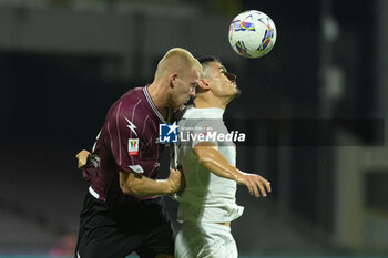 2024-08-12 - Tijs Velthhuis of US Salernitana 1919 competes for the ball with Giuseppe Di Serio of Spezia Calcio during the Soccer Italian Cup Freccia Rossa between US Salernitana 1919 vs Spezia Calcio at Arechi Stadium - US SALERNITANA VS SPEZIA CALCIO - ITALIAN CUP - SOCCER