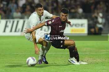 2024-08-12 - Flavius Daniliuc of US Salernitana 1919 competes for the ball with Giuseppe Di Serio of Spezia Calcio during the Soccer Italian Cup Freccia Rossa between US Salernitana 1919 vs Spezia Calcio at Arechi Stadium - US SALERNITANA VS SPEZIA CALCIO - ITALIAN CUP - SOCCER