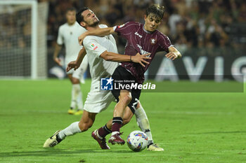 2024-08-12 - Luca Vignali of Spezia Calcio competes for the ball with Andres Emil Sfait of US Salernitana 1919 during the Soccer Italian Cup Freccia Rossa between US Salernitana 1919 vs Spezia Calcio at Arechi Stadium - US SALERNITANA VS SPEZIA CALCIO - ITALIAN CUP - SOCCER