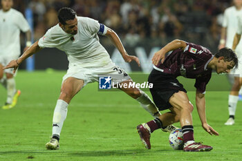 2024-08-12 - Luca Vignali of Spezia Calcio competes for the ball with Andres Emil Sfait of US Salernitana 1919 during the Soccer Italian Cup Freccia Rossa between US Salernitana 1919 vs Spezia Calcio at Arechi Stadium - US SALERNITANA VS SPEZIA CALCIO - ITALIAN CUP - SOCCER