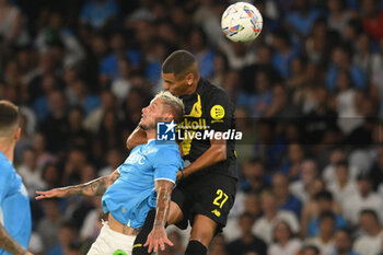 2024-08-10 - Riyad Idrissi of Modena FC competes for the ball with Pasquale Mazzocchi of SSC Napoli during the Soccer Italian Cup Freccia Rossa between SSC Napoli vs Modena FC at Diego Armando Maradona Stadium - SSC NAPOLI VS MODENA FC - ITALIAN CUP - SOCCER