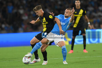 2024-08-10 - Stanislav Lobotka of SSC Napoli competes for the ball with Antonio Palumbo of Modena FC during the Soccer Italian Cup Freccia Rossa between SSC Napoli vs Modena FC at Diego Armando Maradona Stadium - SSC NAPOLI VS MODENA FC - ITALIAN CUP - SOCCER