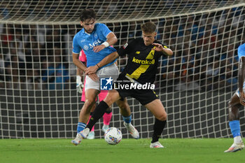 2024-08-10 - Khvicha Kvaratskhelia of SSC Napoli competes for the ball with Ettore Gliozzi of Modena FC during the Soccer Italian Cup Freccia Rossa between SSC Napoli vs Modena FC at Diego Armando Maradona Stadium - SSC NAPOLI VS MODENA FC - ITALIAN CUP - SOCCER