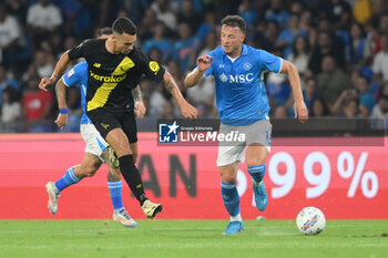 2024-08-10 - Antonio Pergreffi of Modena FC competes for the ball with Amir Rrahmani of SSC Napoli during the Soccer Italian Cup Freccia Rossa between SSC Napoli vs Modena FC at Diego Armando Maradona Stadium - SSC NAPOLI VS MODENA FC - ITALIAN CUP - SOCCER