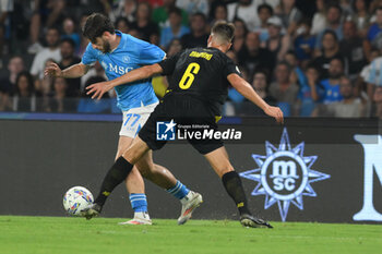 2024-08-10 - Khvicha Kvaratskhelia of SSC Napoli competes for the ball with Luca Magnino of Modena FC during the Soccer Italian Cup Freccia Rossa between SSC Napoli vs Modena FC at Diego Armando Maradona Stadium - SSC NAPOLI VS MODENA FC - ITALIAN CUP - SOCCER