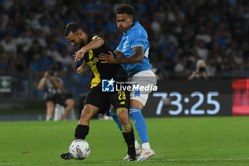 2024-08-10 - Matteo Cotali of Modena FC competes for the ball with Cyril Ngonge of SSC Napoli during the Soccer Italian Cup Freccia Rossa between SSC Napoli vs Modena FC at Diego Armando Maradona Stadium - SSC NAPOLI VS MODENA FC - ITALIAN CUP - SOCCER