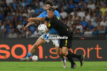 2024-08-10 - Khvicha Kvaratskhelia of SSC Napoli competes for the ball with Luca Magnino of Modena FC during the Soccer Italian Cup Freccia Rossa between SSC Napoli vs Modena FC at Diego Armando Maradona Stadium - SSC NAPOLI VS MODENA FC - ITALIAN CUP - SOCCER