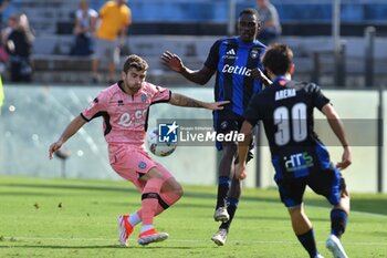 2024-09-25 - Raffaele Celia (Cesena) thwarted by Idrissa Toure' (Pisa) - PISA VS CESENA - ITALIAN CUP - SOCCER