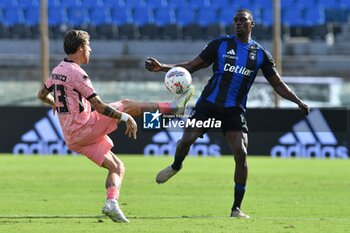 2024-09-25 - Mirko Antonucci (Cesena) thwarted by Idrissa Toure' (Pisa) - PISA VS CESENA - ITALIAN CUP - SOCCER