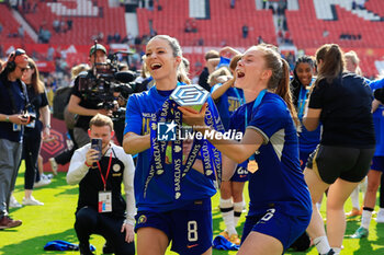 2024-05-18 - Melanie Leupolz (8) and Sjoeke Nusken (6) of Chelsea celebrate the championship title after the FA Women's Super League, English championship football match between Manchester United and Chelsea on 18 May 2024 at Old Trafford in Manchester, England - FOOTBALL - WOMEN'S ENGLISH CHAMP - MANCHESTER UNITED V CHELSEA - ENGLISH FA WOMEN'S SUPER LEAGUE - SOCCER