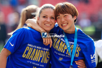 2024-05-18 - Maika Hamano (23) and Melanie Leupolz (8) of Chelsea celebrate the championship title after the FA Women's Super League, English championship football match between Manchester United and Chelsea on 18 May 2024 at Old Trafford in Manchester, England - FOOTBALL - WOMEN'S ENGLISH CHAMP - MANCHESTER UNITED V CHELSEA - ENGLISH FA WOMEN'S SUPER LEAGUE - SOCCER