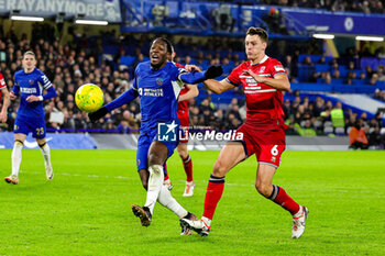 2024-01-23 - Axel Disasi (2) of Chelsea and Dael Fry of Middlesbrough during the English League Cup, EFL Cup, semi final second leg football match between Chelsea and Middlesbrough on 23 January 2024 at Stamford Bridge in London, England - FOOTBALL - ENGLISH LEAGUE CUP - CHELSEA V MIDDLESBROUGH - ENGLISH LEAGUE CUP - SOCCER