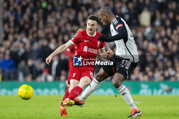 2024-01-24 - Fulham defender Issa Diop (31) fouls Liverpool forward Diogo Jota (20) during the English League Cup, EFL Cup, semi-final second leg football match between Fulham and Liverpool on 24 January 2024 at Craven Cottage in London, England - FOOTBALL - ENGLISH LEAGUE CUP - FULHAM V LIVERPOOL - ENGLISH LEAGUE CUP - SOCCER
