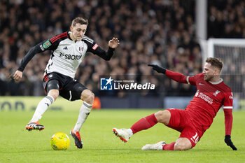 2024-01-24 - Fulham defender Timothy Castagne (21) and Liverpool midfielder Alexis Mac Allister (10) during the English League Cup, EFL Cup, semi-final second leg football match between Fulham and Liverpool on 24 January 2024 at Craven Cottage in London, England - FOOTBALL - ENGLISH LEAGUE CUP - FULHAM V LIVERPOOL - ENGLISH LEAGUE CUP - SOCCER