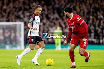 2024-01-24 - Fulham midfielder Bobby Reid (14) and Liverpool defender Joe Gomez (2) during the English League Cup, EFL Cup, semi-final second leg football match between Fulham and Liverpool on 24 January 2024 at Craven Cottage in London, England - FOOTBALL - ENGLISH LEAGUE CUP - FULHAM V LIVERPOOL - ENGLISH LEAGUE CUP - SOCCER