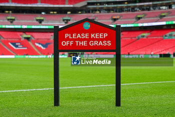 2024-02-25 - General view inside Wembley Stadium with a keep off the grass sign ahead of the English League Cup, EFL Cup, Carabao Cup, Final football match between Chelsea and Liverpool on 25 February 2024 at Wembley Stadium in London, England - FOOTBALL - ENGLISH LEAGUE CUP - FINAL - CHELSEA V LIVERPOOL - ENGLISH LEAGUE CUP - SOCCER