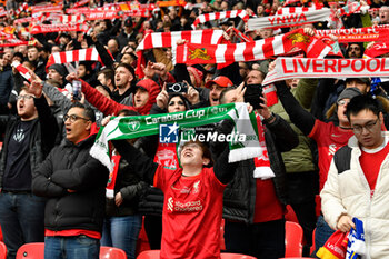 2024-02-25 - Liverpool fans sing You’ll Never Walk Alone with their scarves held above their heads ahead of the English League Cup, EFL Cup, Carabao Cup, Final football match between Chelsea and Liverpool on 25 February 2024 at Wembley Stadium in London, England - FOOTBALL - ENGLISH LEAGUE CUP - FINAL - CHELSEA V LIVERPOOL - ENGLISH LEAGUE CUP - SOCCER