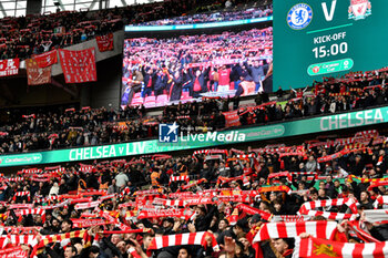 2024-02-25 - Liverpool fans sing You’ll Never Walk Alone with their scarves held above their heads ahead of the English League Cup, EFL Cup, Carabao Cup, Final football match between Chelsea and Liverpool on 25 February 2024 at Wembley Stadium in London, England - FOOTBALL - ENGLISH LEAGUE CUP - FINAL - CHELSEA V LIVERPOOL - ENGLISH LEAGUE CUP - SOCCER
