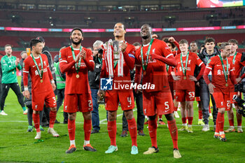 2024-02-25 - Virgil van Dijk (4), Joe Gomez (2) and Ibrahima Konate (5) of Liverpool celebrate after winning the English League Cup, EFL Cup, Carabao Cup, Final football match between Chelsea and Liverpool on 25 February 2024 at Wembley Stadium in London, England - FOOTBALL - ENGLISH LEAGUE CUP - FINAL - CHELSEA V LIVERPOOL - ENGLISH LEAGUE CUP - SOCCER