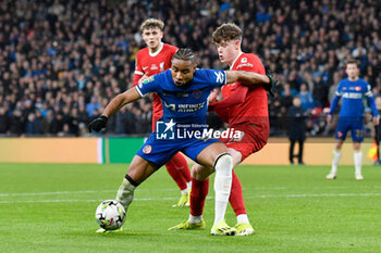 2024-02-25 - Christopher Nkunku (18) of Chelsea and James McConnell (53) of Liverpool during the English League Cup, EFL Cup, Carabao Cup, Final football match between Chelsea and Liverpool on 25 February 2024 at Wembley Stadium in London, England - FOOTBALL - ENGLISH LEAGUE CUP - FINAL - CHELSEA V LIVERPOOL - ENGLISH LEAGUE CUP - SOCCER