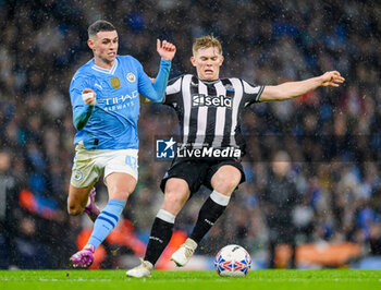 2024-03-16 - Lewis Hall of Newcastle Utd and Phil Foden of Manchester City during the English FA Cup, quarter final football match between Manchester City and Newcastle United on 16 March 2024 at the Etihad Stadium in Manchester, England - FOOTBALL - ENGLISH CUP - MANCHESTER CITY V NEWCASTLE - ENGLISH LEAGUE CUP - SOCCER
