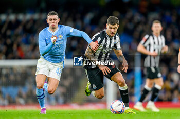 2024-03-16 - Bruno Guimaraes of Newcastle Utd holds off Phil Foden of Manchester City during the English FA Cup, quarter final football match between Manchester City and Newcastle United on 16 March 2024 at the Etihad Stadium in Manchester, England - FOOTBALL - ENGLISH CUP - MANCHESTER CITY V NEWCASTLE - ENGLISH LEAGUE CUP - SOCCER