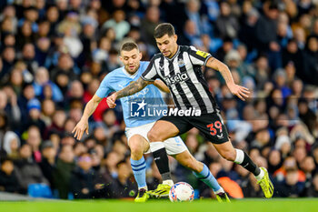 2024-03-16 - Bruno Guimaraes of Newcastle Utd holds off Mateo Kovacic of Manchester City during the English FA Cup, quarter final football match between Manchester City and Newcastle United on 16 March 2024 at the Etihad Stadium in Manchester, England - FOOTBALL - ENGLISH CUP - MANCHESTER CITY V NEWCASTLE - ENGLISH LEAGUE CUP - SOCCER
