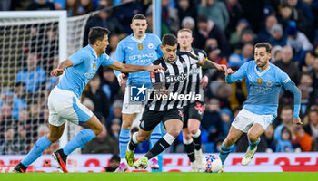 2024-03-16 - Bruno Guimaraes of Newcastle Utd cuts between Rodri and Bernardo Silva of Manchester City during the English FA Cup, quarter final football match between Manchester City and Newcastle United on 16 March 2024 at the Etihad Stadium in Manchester, England - FOOTBALL - ENGLISH CUP - MANCHESTER CITY V NEWCASTLE - ENGLISH LEAGUE CUP - SOCCER
