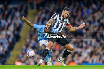 2024-03-16 - Jeremy Doku of Manchester City tries to hold off Jamaal Lascelles of Newcastle during the English FA Cup, quarter final football match between Manchester City and Newcastle United on 16 March 2024 at the Etihad Stadium in Manchester, England - FOOTBALL - ENGLISH CUP - MANCHESTER CITY V NEWCASTLE - ENGLISH LEAGUE CUP - SOCCER