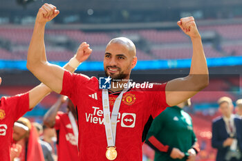 2024-05-25 - Sofyan Amrabat (4) of Manchester United celebrates after the 1-2 victory during the English FA Cup, Final football match between Manchester City and Manchester United on 25 May 2024 at Wembley Stadium in London, England - FOOTBALL - ENGLISH CUP - FINAL - MANCHESTER CITY V MANCHESTER UNITED - ENGLISH LEAGUE CUP - SOCCER