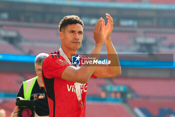 2024-05-25 - Raphael Varane (19) of Manchester United celebrates after the 1-2 victory during the English FA Cup, Final football match between Manchester City and Manchester United on 25 May 2024 at Wembley Stadium in London, England - FOOTBALL - ENGLISH CUP - FINAL - MANCHESTER CITY V MANCHESTER UNITED - ENGLISH LEAGUE CUP - SOCCER