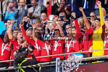 2024-05-25 - Bruno Fernandes (8) of Manchester United lifts the FA Cup after the 1-2 victory during the English FA Cup, Final football match between Manchester City and Manchester United on 25 May 2024 at Wembley Stadium in London, England - FOOTBALL - ENGLISH CUP - FINAL - MANCHESTER CITY V MANCHESTER UNITED - ENGLISH LEAGUE CUP - SOCCER